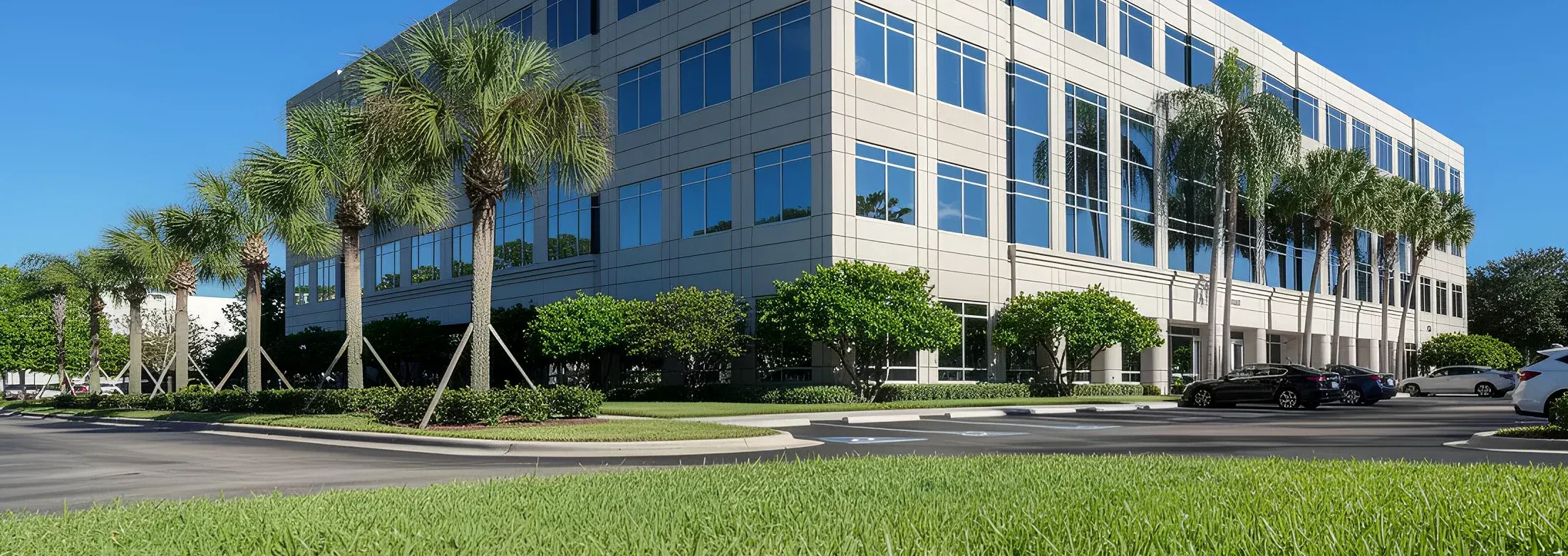 Florida commercial building with with lush grass and green shrubs