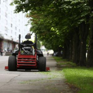 guy riding lawn mower at commercial property